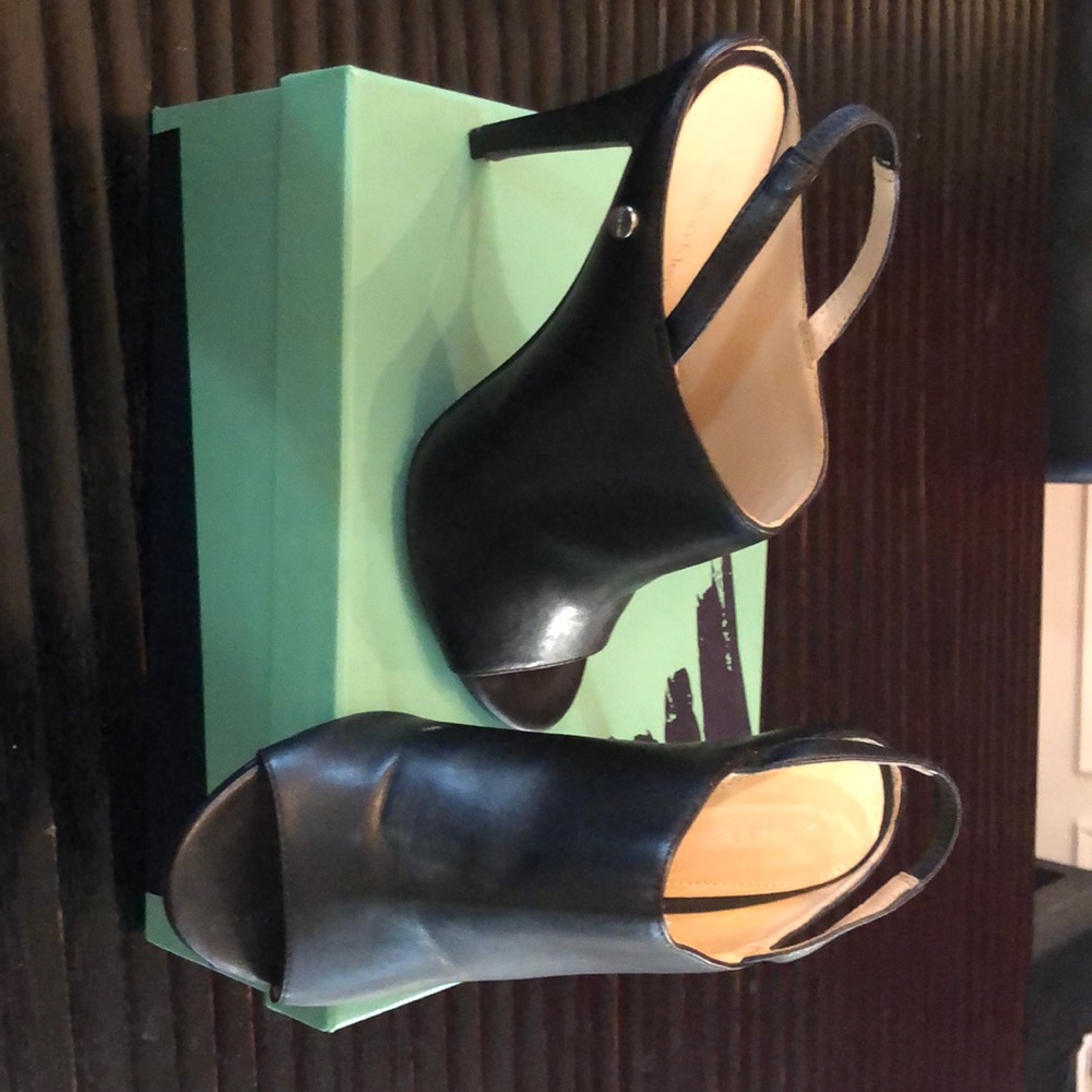 Black leather sling back mule